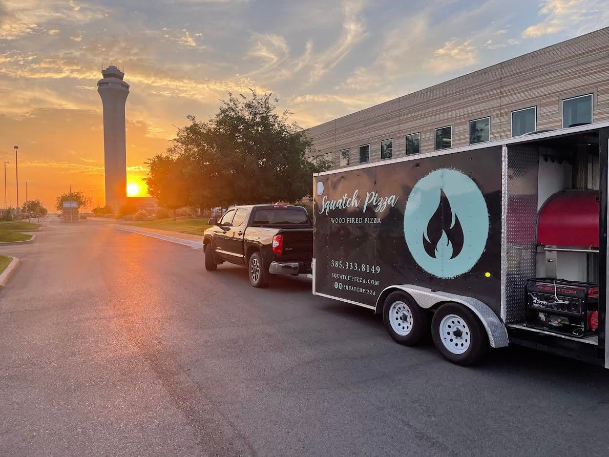 Squatch Pizza food truck trailer parked at a commercial venue