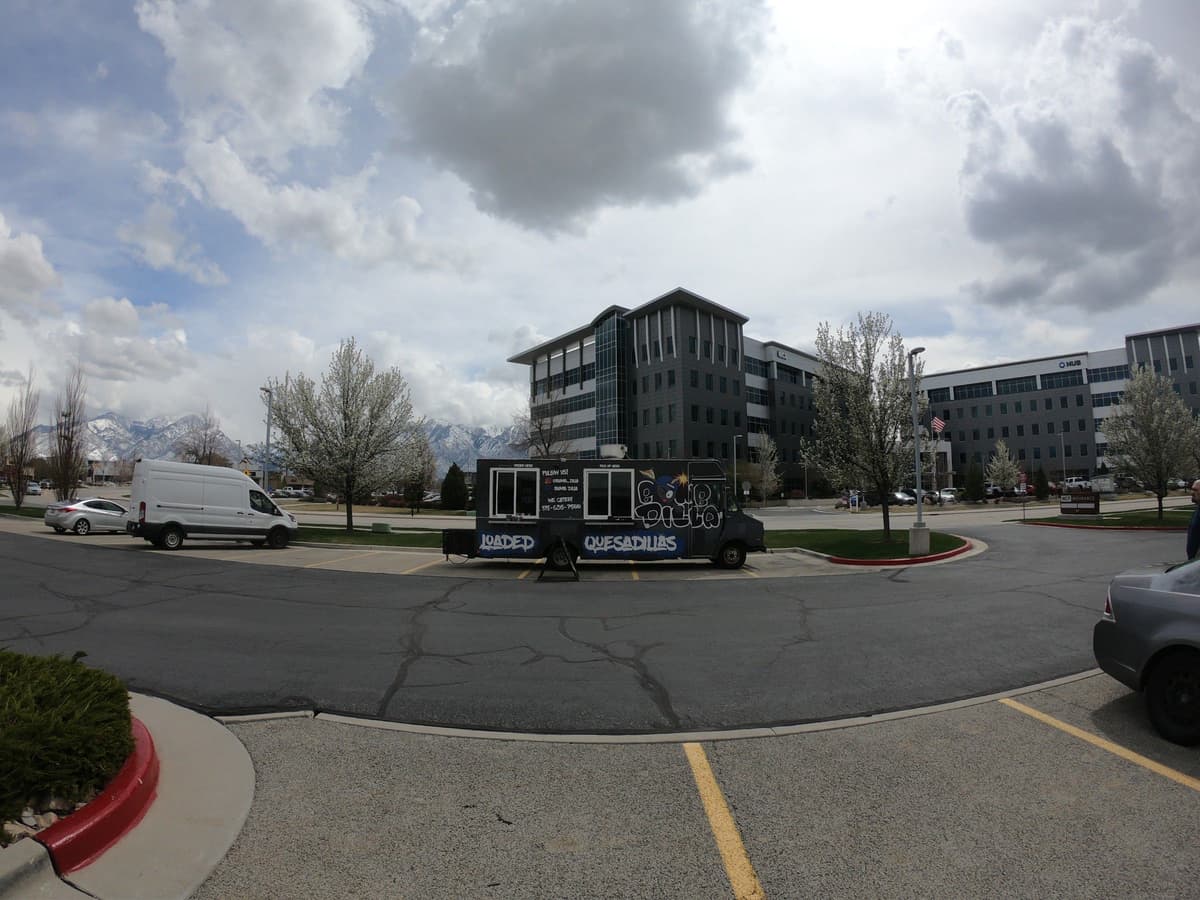 Bomb Dilla food truck parked in an office parking lot ready to serve a company lunch