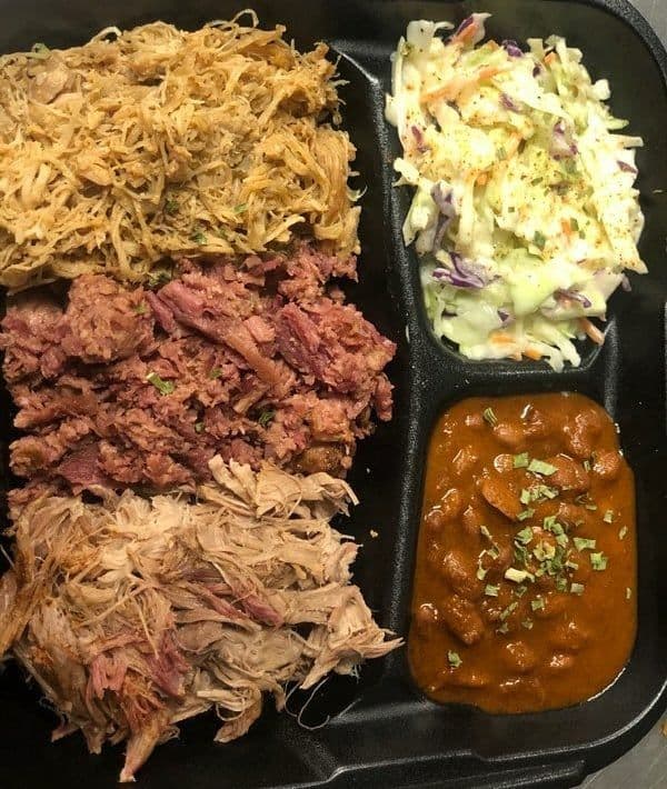BBQ food truck catering with pulled pork, brisket, coleslaw, and beans