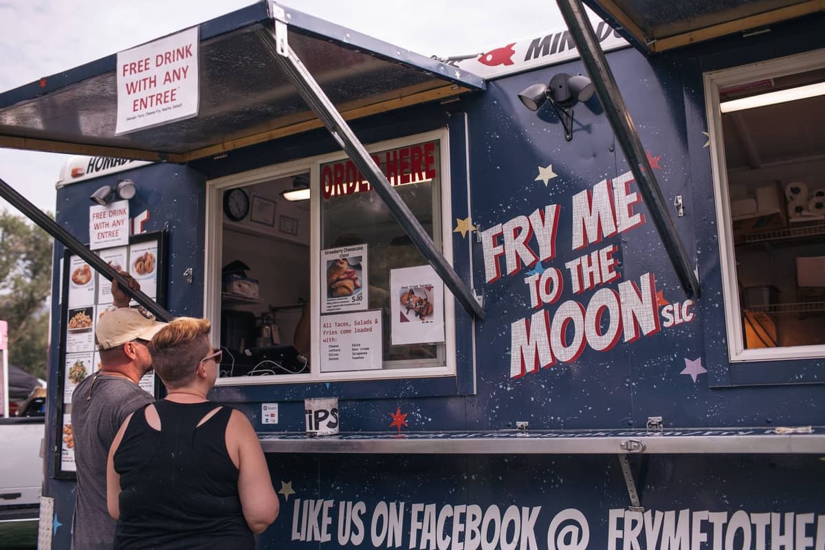 guest ordering at a food truck catering event