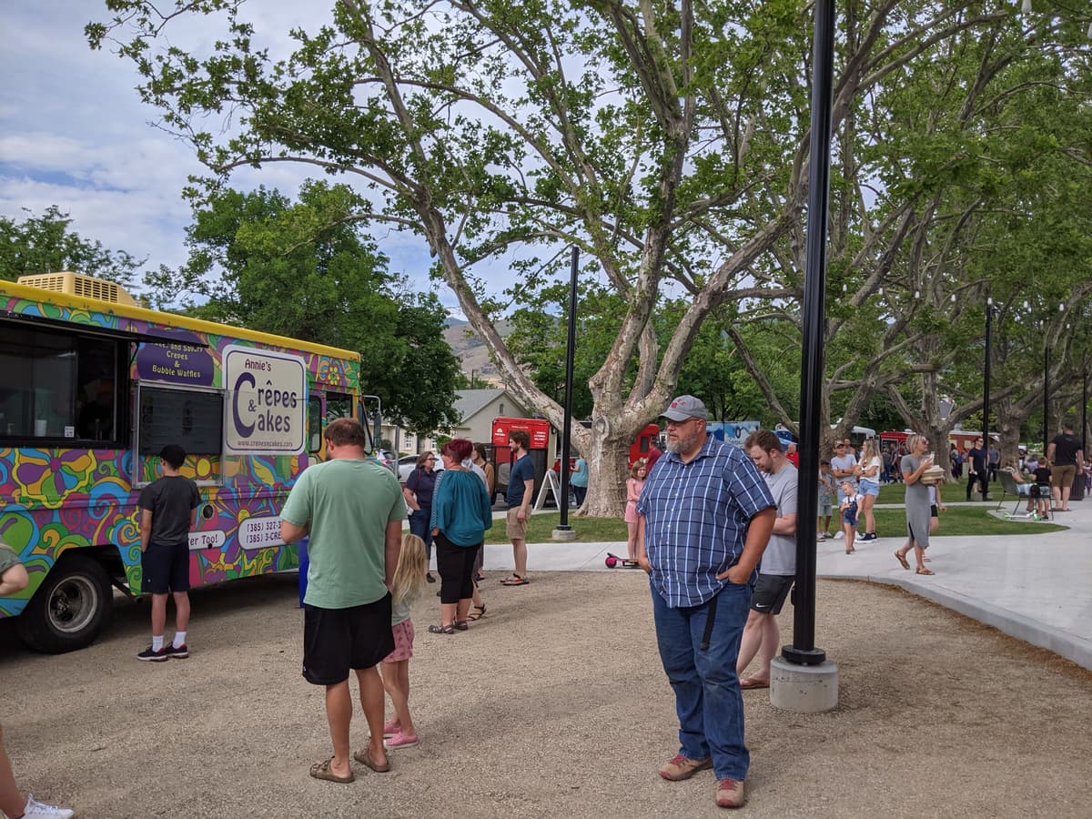 community gathering at a Food Truck League event with vetted food trucks